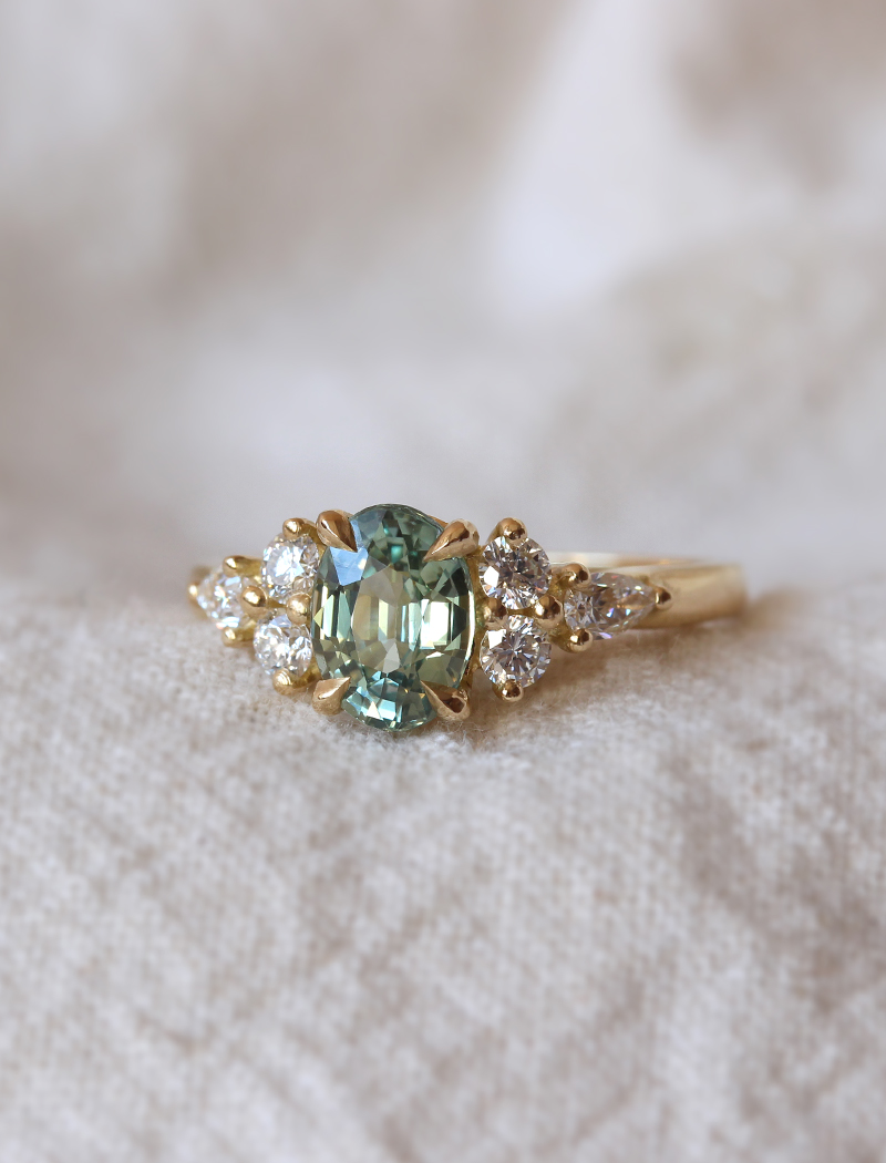 dainty emerald engagement ring